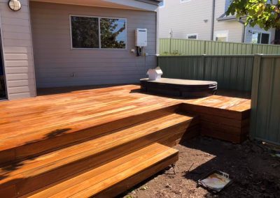 Timber deck with wide steps down to the garden and a spa on the deck