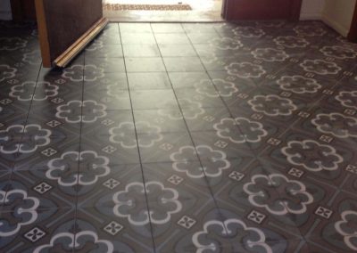 Black and white patterned floor tiles in an entry hall