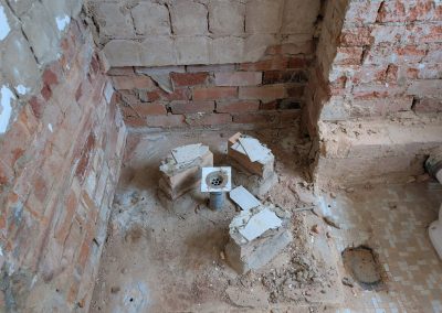 Old shower base broken up down to the brickwork during demolition