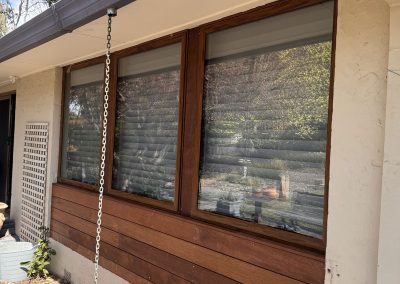 Close view of timber cladding under timber window frames